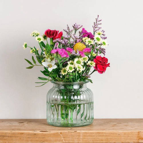 Botanical Posy in a vase next to a laptop